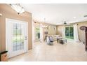 Bright and airy living room featuring tile floors, neutral colors, and sliding doors to the backyard at 432 Harbor Winds Ct, Winter Springs, FL 32708
