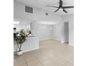 Bright living room features tile floors and neutral walls, showcasing an open layout and airy atmosphere at 4636 Fern Pine Dr, Orlando, FL 32808