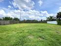 Large, fenced backyard perfect for entertaining or enjoying outdoor activities at 5050 Hidden Springs Blvd, Orlando, FL 32819