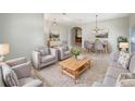 Cozy living room features neutral tones, plush seating, and abundant natural light at 5236 Shale Ridge Trl, Orlando, FL 32818