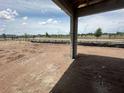 Unfinished backyard with new construction columns, offering a picturesque outdoor view at 5391 Park Guell St, St Cloud, FL 34771