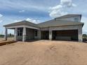 New construction home featuring a block exterior, covered porch and a spacious three car garage at 5391 Park Guell St, St Cloud, FL 34771