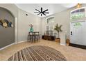Inviting home entryway with high ceilings, modern decor, and natural light filling the space at 6542 Lake Pembroke Pl, Orlando, FL 32829