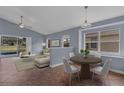 Bright living room featuring sliding glass doors leading to the pool area and a comfortable seating area at 6702 Imperial Oak Ln, Orlando, FL 32819
