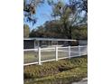 Charming home featuring a well-maintained front yard and classic white picket fence at 732 Trenton Rd, Lakeland, FL 33815