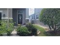 Inviting front entrance with stone accents and lush landscaping creating curb appeal at 10658 Bannan St, Orlando, FL 32832