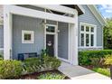 Inviting front porch with seating, plants, and charming details that create a welcoming entry at 1330 W Harvard St, Orlando, FL 32804