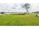 Large grassy backyard with waterfront views and access to the lake with private docks at 1354 S Shore Dr, St Cloud, FL 34771