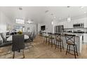 Open concept kitchen with stainless steel appliances, granite countertops, and bar seating at 16162 Arbor Crest Aly, Winter Garden, FL 34787