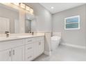 Spacious bathroom with double vanity, soaking tub, and modern lighting offering a spa-like experience at 16253 Sw 29Th Court Rd, Ocala, FL 34473