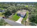Charming single-story home with a well-manicured lawn and an attached two-car garage at 16253 Sw 29Th Court Rd, Ocala, FL 34473