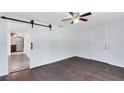 Bedroom featuring a ceiling fan and view into the kitchen at 1701 E Bay St, Winter Garden, FL 34787