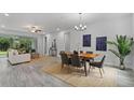 Open concept living and dining area with neutral tones and lots of natural light at 18743 Overton St, Orlando, FL 32833