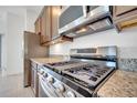 Modern kitchen with stainless steel appliances and granite countertops at 2362 Datura Loop, St Cloud, FL 34772
