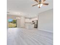 Open-concept living space with an island kitchen and stainless steel appliances at 2531 Sw 167Th Loop, Ocala, FL 34473
