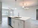 Open-concept living area with views of kitchen island and a ceiling fan at 2531 Sw 167Th Loop, Ocala, FL 34473
