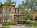 Charming two-story home with a well-manicured lawn and inviting front entrance at 4143 Calabria Ave, Davenport, FL 33897