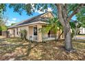 Side view of single Gathering home featuring mature landscaping and a fenced yard at 4406 Brookstone Ct, Orlando, FL 32826