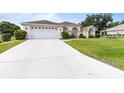 Lovely single-story home with a long driveway and well-maintained front yard, perfect for suburban living at 5076 Nw 21St Loop, Ocala, FL 34482