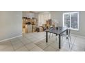 Spacious dining area with tile floors and large window offering plenty of sunlight at 5833 La Costa Dr # S, Orlando, FL 32807