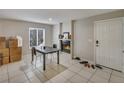 Cozy living room with fireplace, neutral tones, and bright natural light at 5833 La Costa Dr # S, Orlando, FL 32807