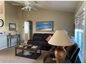 Comfortable living room featuring a ceiling fan, neutral paint, and a cozy seating area at 8187 Sw 60Th Ter, Ocala, FL 34476