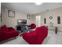 Inviting living room with comfortable seating and neutral wall color at 1165 Stratton Ave, Groveland, FL 34736