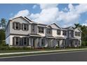 New townhomes with diverse exteriors, showcasing unique color palettes and inviting entrances, offering an array of curb appeal choices at 1415 Mount Royal Dr, St Cloud, FL 34771