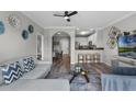 Bright and airy living room featuring modern decor, wood floors and an open concept design leading to the kitchen at 14200 Avalon Rd # 409, Winter Garden, FL 34787