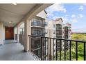 View from the balcony showcasing the building's architecture and green landscape at 14501 Grove Resort Ave # 3636, Winter Garden, FL 34787