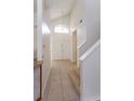 Entryway featuring a soaring ceiling, a hanging light, and neutral tile flooring at 2903 Joseph Cir, Oviedo, FL 32765