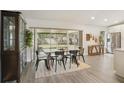 Bright dining area next to screened in porch and modern refrigerator, perfect for entertaining and everyday living at 620 Fruitwood Ave, Winter Springs, FL 32708