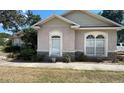 Close-up view showcasing the architectural detailing including decorative windows at 6438 Bristol Oaks Dr, Lakeland, FL 33811