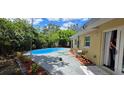 Inviting backyard features a private in-ground pool with a patio area at 7600 Skyview Dr, Orlando, FL 32809