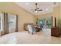 Spacious living room with high ceilings, tile flooring, and sliding glass doors to the lanai at 939 Glen Abbey Cir, Winter Springs, FL 32708