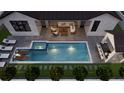Aerial view of an inviting backyard with a sparkling pool, lounge chairs, and an outdoor seating area at 985 Lincoln Cir, Winter Park, FL 32789