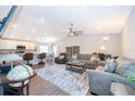 Spacious living room with wood flooring and an open floor plan to the kitchen at 2226 Majestic Span Ave, Eagle Lake, FL 33839