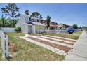 Charming two-story home with fresh landscaping, unique driveway, and convenient parking in a vibrant community at 2714 Hunt Club Ln, Orlando, FL 32826