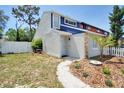 Two-story home with freshly landscaped front yard and a charming walkway leading to the front door at 2714 Hunt Club Ln, Orlando, FL 32826