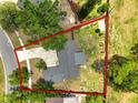 Aerial view of landscaped property highlighting a backyard and concrete driveway at 3520 Balsam Dr, Winter Park, FL 32792