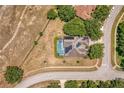 Aerial view of the property showcasing the house, pool, and solar panels on the roof at 3697 Rolling Hills Ln, Apopka, FL 32712