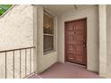 Exterior view of the front door to the residence with a window and security railing at 514 Orange Dr # 31, Altamonte Springs, FL 32701