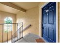 Close-up of a front door with a porch showcasing the entrance to this home at 5168 Conroy Rd # 35, Orlando, FL 32811