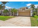 Well-maintained home with a two-car garage, beautiful landscaping, and a freshly manicured lawn at 10161 Sandy Marsh Ln, Orlando, FL 32832