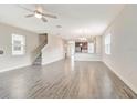 Spacious living room with tile flooring and staircase access at 11807 Charades St, Orlando, FL 32832