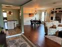 Open-concept living room and dining area with modern decor and plenty of natural light at 1203 Monterey Dr, Eustis, FL 32726