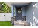 Inviting home entryway with stylish stone pillars and neutral colors at 1203 W 16Th St, Sanford, FL 32771