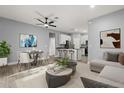 Open concept living and dining area with modern furnishings and decor at 1203 W 16Th St, Sanford, FL 32771