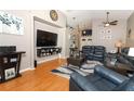 Open-concept living room with vaulted ceilings and hardwood flooring at 1825 Needham Rd, Apopka, FL 32712