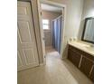 The bathroom offers a tile floor, updated vanity, and shower-tub combo at 1880 N Crystal Lake Dr # 3, Lakeland, FL 33801
